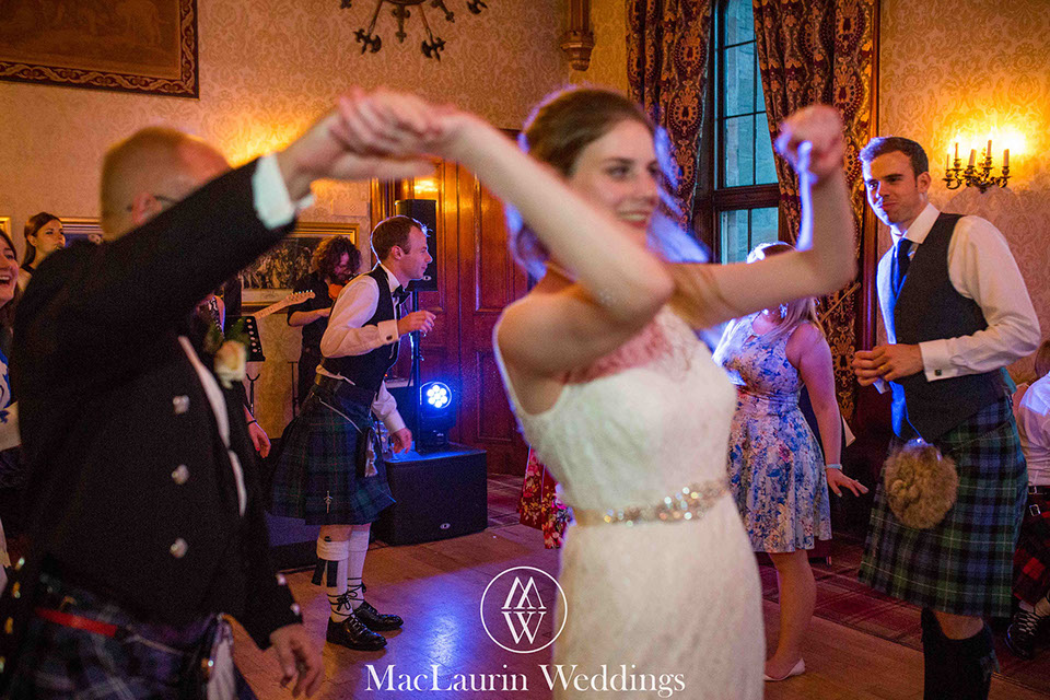 a dancing bride in full swing at dalhousie castle scotland