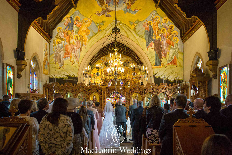 interior of the church during ceremony at a traditional greek wedding london