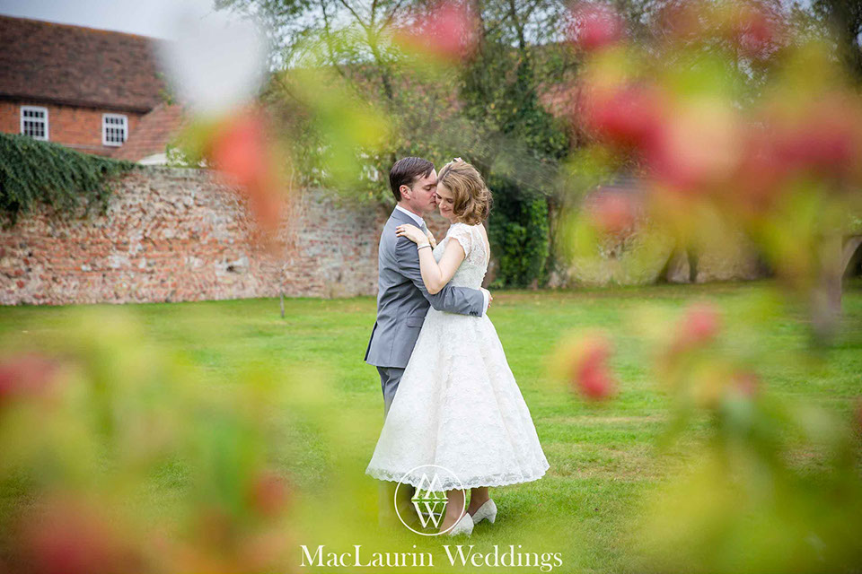bride and groom embrace during a portrait