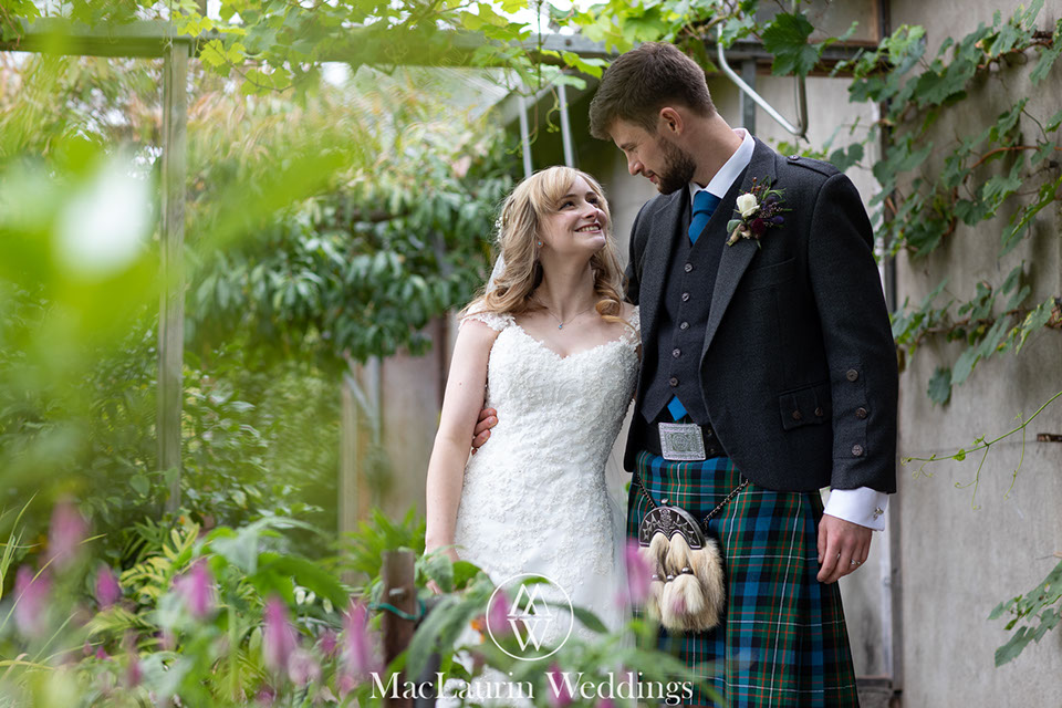hairstylist styling hair before the wedding 