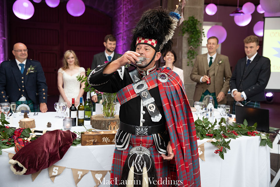 hairstylist styling hair before the wedding 