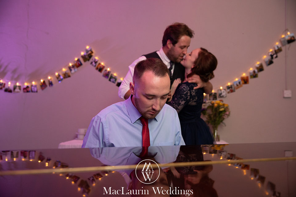 hairstylist styling hair before the wedding 