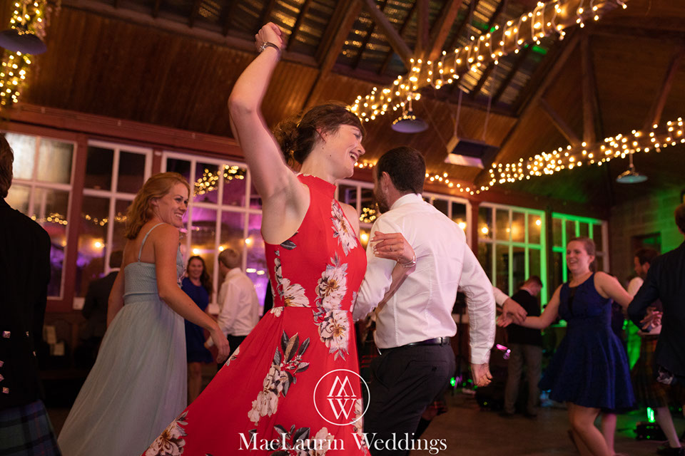 hairstylist styling hair before the wedding 