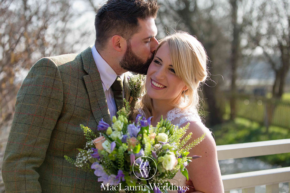 an intimate kiss with the bride