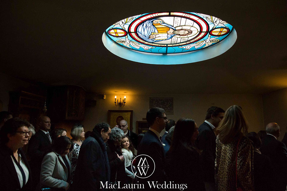 guests filing out of the church after a traditional greek wedding