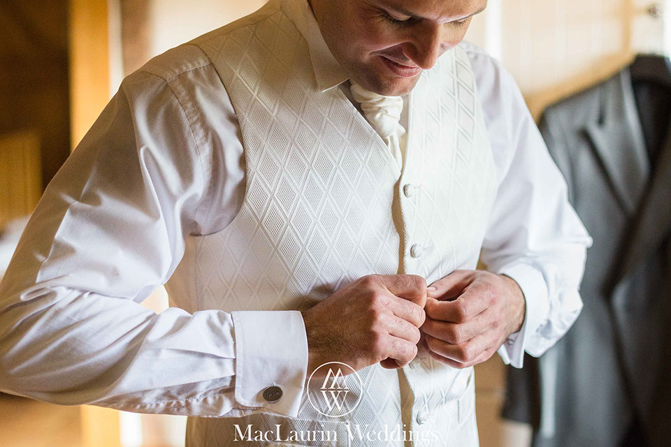 a groom getting ready before the wedding